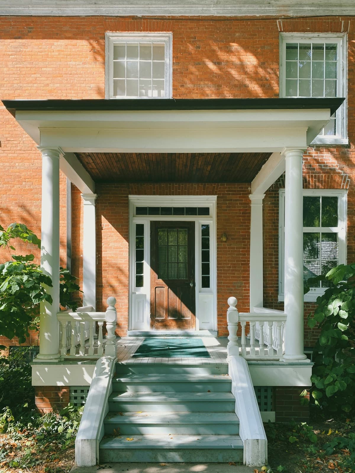 Brick house with a white columned porch